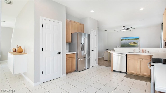 kitchen with light tile patterned floors, light countertops, visible vents, appliances with stainless steel finishes, and a ceiling fan