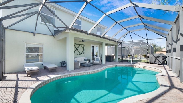 outdoor pool featuring a patio, grilling area, a lanai, and an outdoor living space