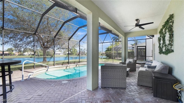 outdoor pool with a water view, an outdoor hangout area, a patio area, ceiling fan, and a lanai