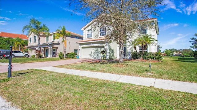 view of front of property with a front yard and a garage