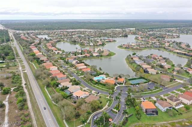 drone / aerial view featuring a water view and a residential view