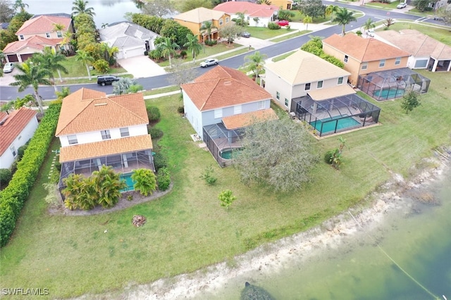 bird's eye view featuring a residential view and a water view