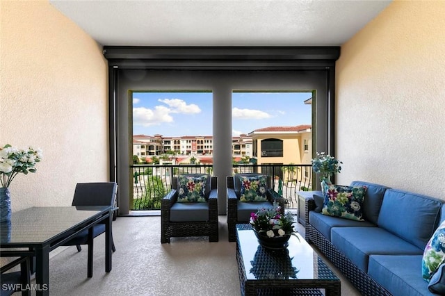 21490 Strada Nuova Cir Unit D307, Estero, FL 33928 - living area featuring a textured wall and carpet