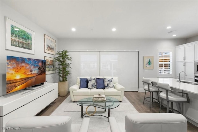 21490 Strada Nuova Cir Unit D307, Estero, FL 33928 - living area featuring wood finished floors and recessed lighting