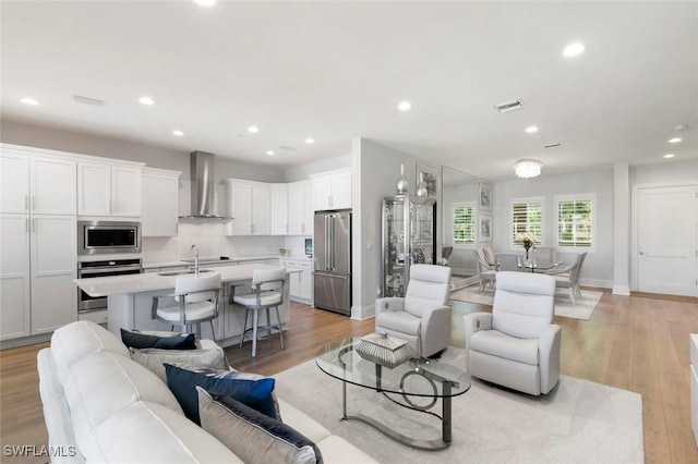 21490 Strada Nuova Cir Unit D307, Estero, FL 33928 - living room featuring recessed lighting, light wood-style flooring, and baseboards