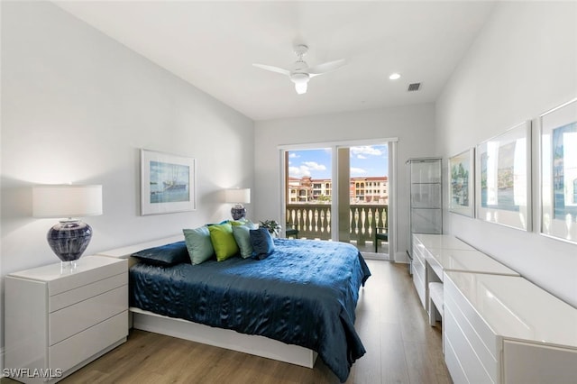 bedroom with a water view, ceiling fan, light hardwood / wood-style floors, and access to outside