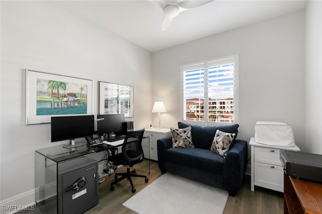 office space with ceiling fan and dark hardwood / wood-style flooring