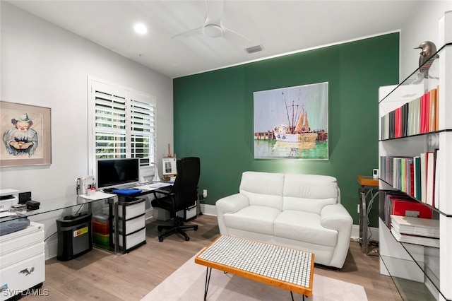 office area with light hardwood / wood-style floors and ceiling fan