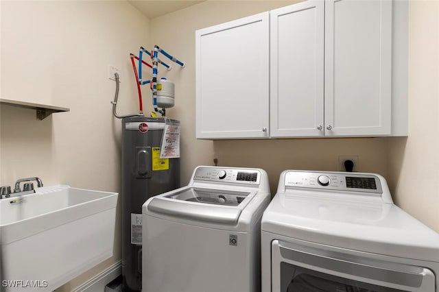 laundry room with independent washer and dryer, cabinets, sink, and electric water heater