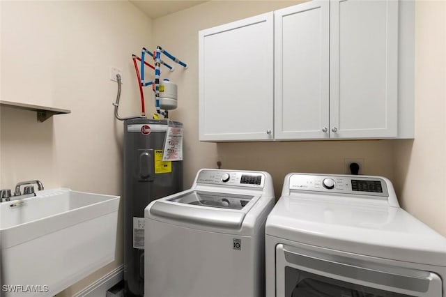 21490 Strada Nuova Cir Unit D307, Estero, FL 33928 - washroom featuring independent washer and dryer, water heater, and cabinet space