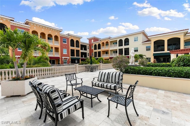 view of patio featuring a balcony