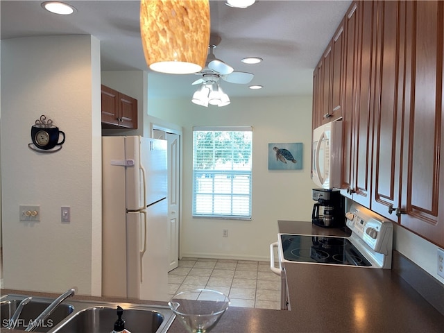 kitchen featuring sink, white appliances, light tile patterned floors, and ceiling fan