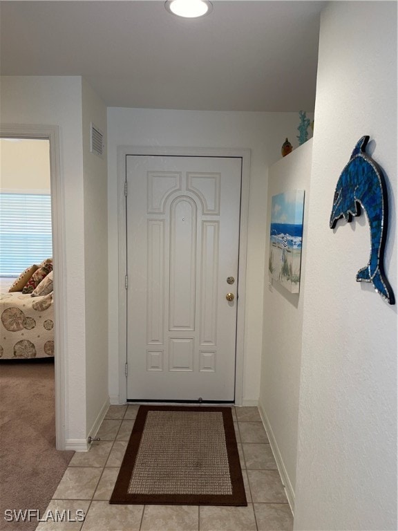 entryway featuring light tile patterned floors