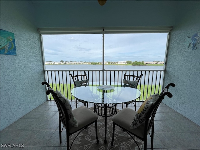 balcony featuring a water view