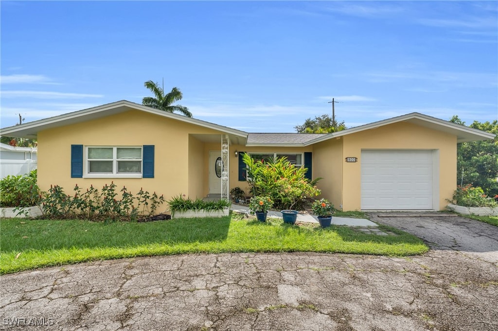 single story home featuring a garage