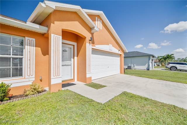 exterior space with a lawn and a garage