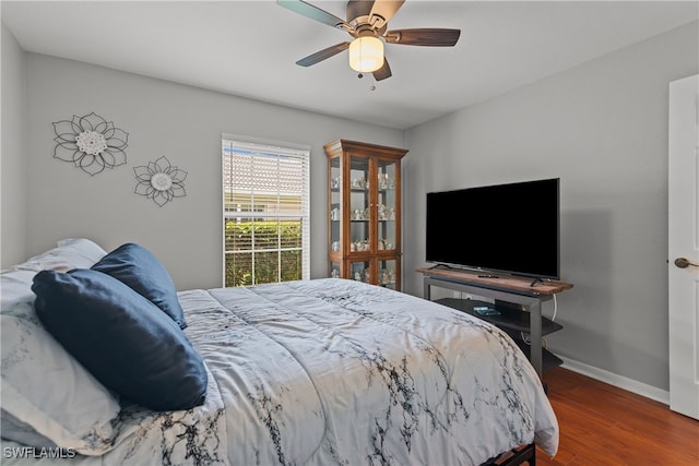 bedroom featuring ceiling fan and hardwood / wood-style floors