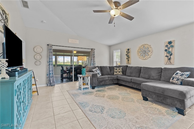 living room with light tile patterned flooring, lofted ceiling, and ceiling fan