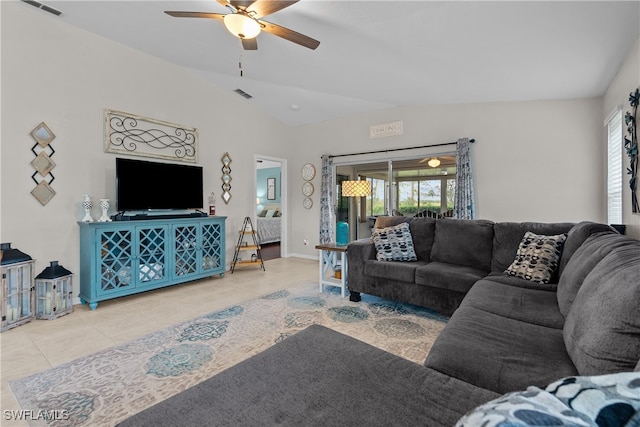 living room featuring ceiling fan, light tile patterned flooring, and vaulted ceiling