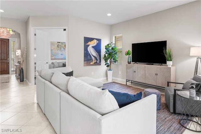 tiled living room with plenty of natural light