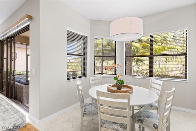 11077 Esteban Dr, Fort Myers, FL 33912 - dining room featuring baseboards and light tile patterned flooring