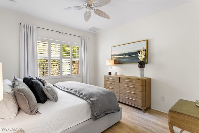 bedroom featuring ceiling fan and light hardwood / wood-style flooring