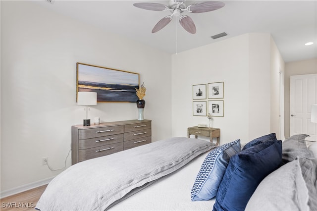 bedroom with ceiling fan and light hardwood / wood-style floors