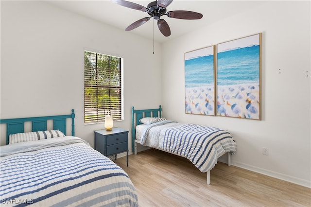 bedroom featuring light hardwood / wood-style floors and ceiling fan