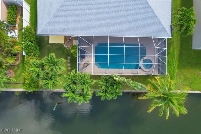 birds eye view of property with a water view