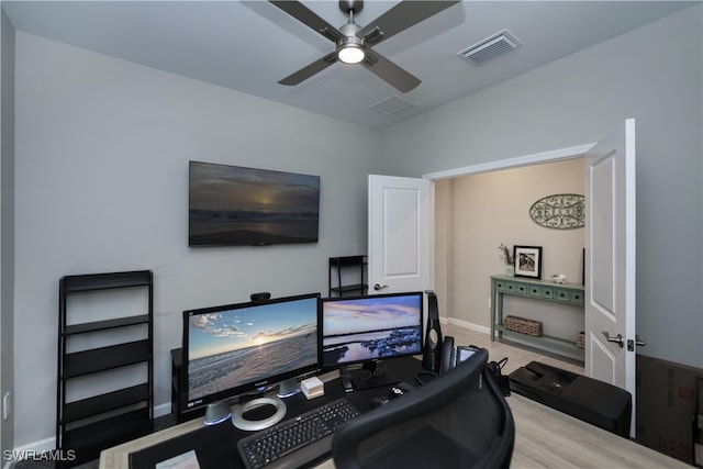 home office featuring ceiling fan and light wood-type flooring