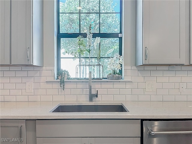 kitchen with light stone counters and plenty of natural light