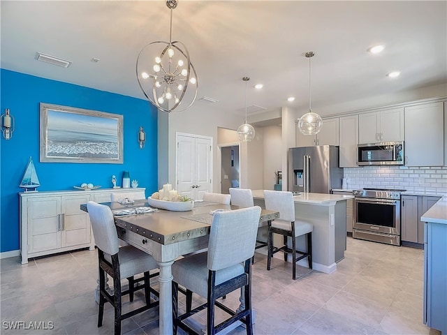 dining space featuring a notable chandelier