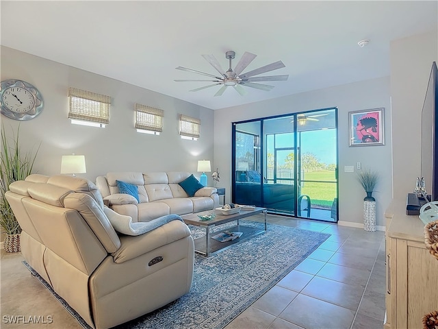 tiled living room featuring a healthy amount of sunlight