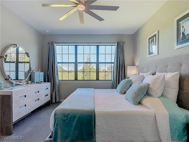 carpeted bedroom featuring ceiling fan