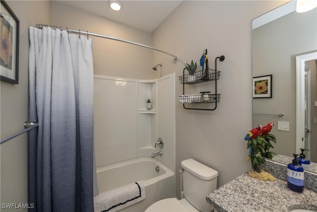 full bathroom featuring vanity, shower / bath combo, and toilet