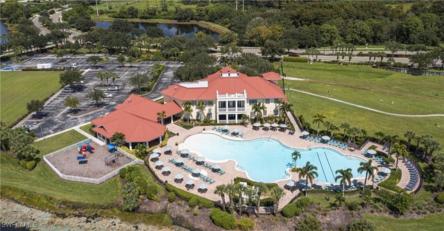 birds eye view of property with a water view