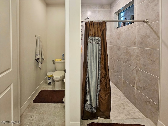 bathroom featuring toilet, walk in shower, and tile patterned flooring