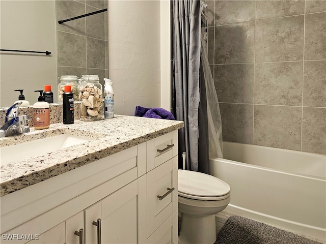 full bathroom featuring vanity, shower / tub combo with curtain, and toilet