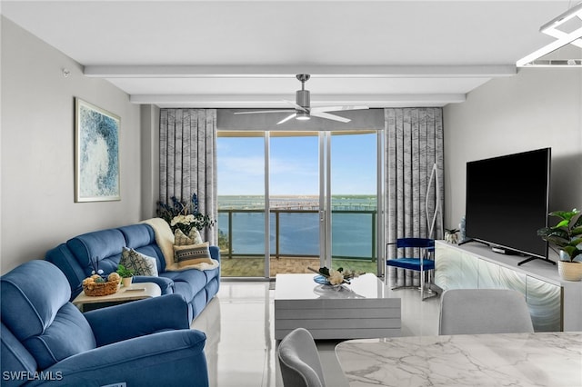 living room featuring beamed ceiling and ceiling fan