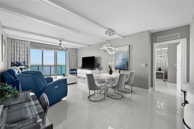 living room featuring light tile patterned flooring and ceiling fan with notable chandelier