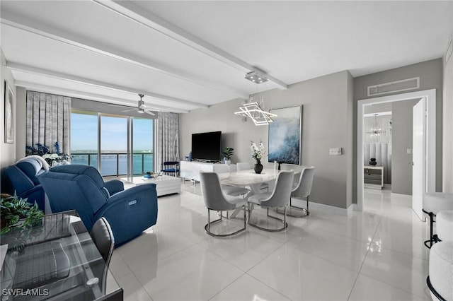 living area featuring beamed ceiling, light tile patterned flooring, visible vents, and baseboards