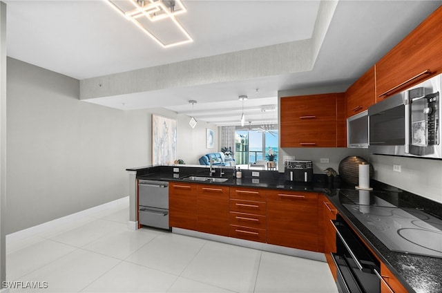 kitchen featuring pendant lighting, light tile patterned floors, sink, black appliances, and an inviting chandelier