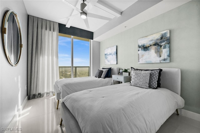 tiled bedroom featuring ceiling fan