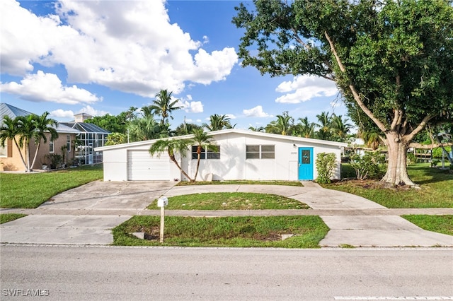 ranch-style house with a front yard, a garage, and glass enclosure