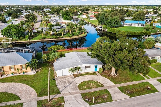 drone / aerial view with a water view and a residential view