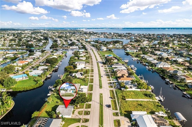 bird's eye view with a residential view and a water view