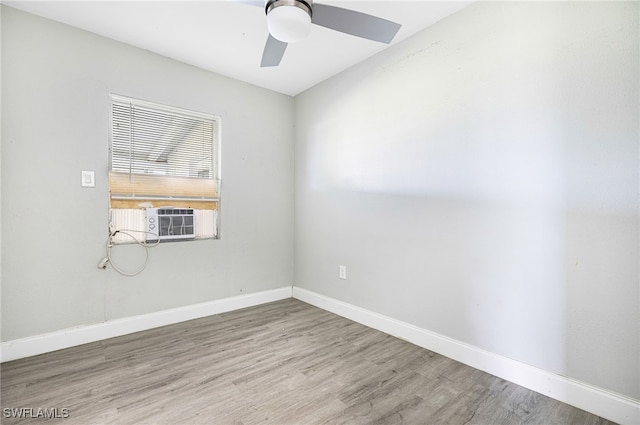 empty room featuring ceiling fan and hardwood / wood-style flooring