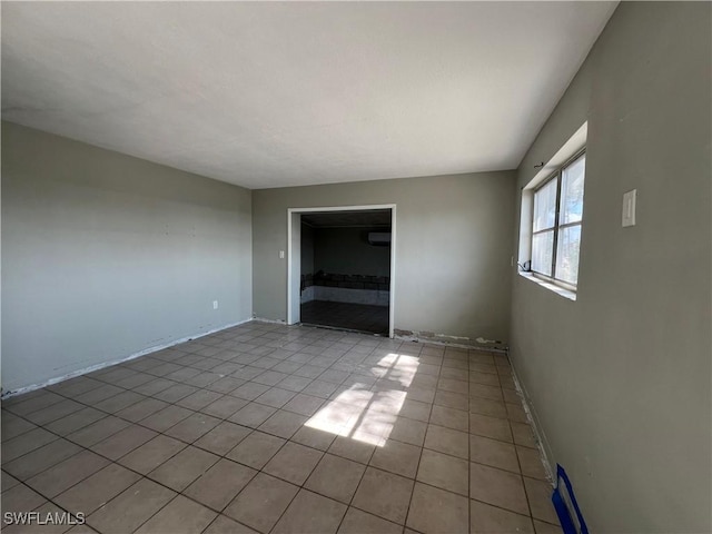 unfurnished room featuring light tile patterned flooring