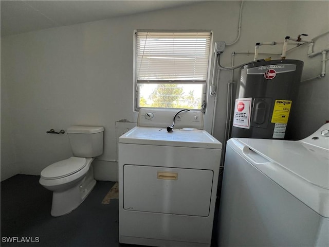 laundry area featuring laundry area, electric water heater, and independent washer and dryer