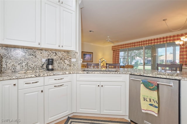 kitchen featuring stainless steel dishwasher, ornamental molding, sink, and white cabinets